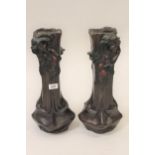 Pair of dark patinated and painted bronze vases in Art Nouveau style, decorated in high relief