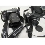 Olypmus E-330 digital camera, together with an Olympus SP500UZ camera