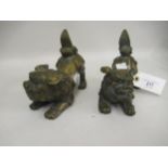 Pair of Chinese bronze patinated dog of foe figures, 5.5ins high x 6ins wide