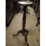 Walnut torchere with a dish top, turned column and tripod base and a primitive elm stool