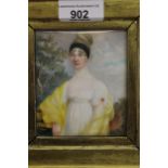 Early 19th Century watercolour portrait miniature on ivory of a lady in yellow, indistinctly signed,