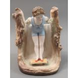 Small late 19th / early 20th Century bisque vase applied with a stooping figure of a girl on a
