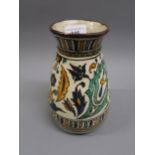 Iznik type pottery baluster form vase decorated with stylised flowerheads, 7.5ins high,