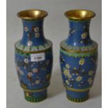 Pair of 20th Century cloisonne baluster form vases with floral decoration on a blue ground, 10ins