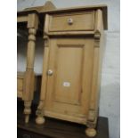 Continental stripped pine bedside cabinet with a single drawer, above a cupboard door, together with