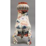 19th Century Japanese porcelain samovar decorated in Imari colours, with a metal spout and figural