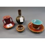 Small Linthorpe pottery two handled vase, similar baluster vase with narrow neck, a cup, two saucers