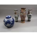 Pair of 19th Century Chinese blue and white crackleware baluster form vases, incised seal marks to