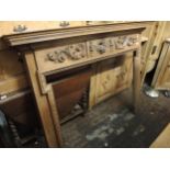 20th Century pitch pine fire surround in Adam's style with floral carved applied decoration Not