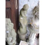 Weathered cast concrete figure of a seated classical maiden on a fluted column plinth, 47ins high