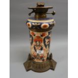 Victorian pottery and brass mounted oil lamp decorated in Imari colours together with a quantity