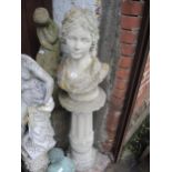 Weathered cast concrete bust of a classical maiden on a cast concrete fluted and tulip motif