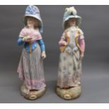 Pair of large good quality 19th Century French bisque figures of ladies, each wearing a bonnet and
