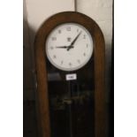 Mid 20th Century oak cased pulse clock by S.T.C London, 52.5ins high