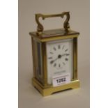 Mappin & Webb gilt brass carriage clock, the enamel dial with Roman numerals