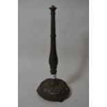 Arts & Crafts bronze table lamp, the turned column on a floral pierced dome base, raised on three