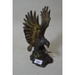 Brown and gilt patinated bronze figure of an eagle