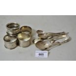 Five silver napkin rings, silver caddy spoon, pair of sugar tongs, two salt spoons etc.