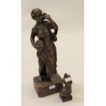 Carved oak figure of a woman carrying a basket of flowers on an integral plinth, 21.5ins high