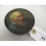 Small 19th Century black lacquer papier mache circular snuff box, the lid painted with a portrait of