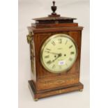 Regency rosewood and cut brass inlaid bracket clock, the pagoda case with brass ring handles and