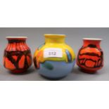 Poole pottery squat baluster form vase, in orange, yellow and mauve and two small Poole pottery