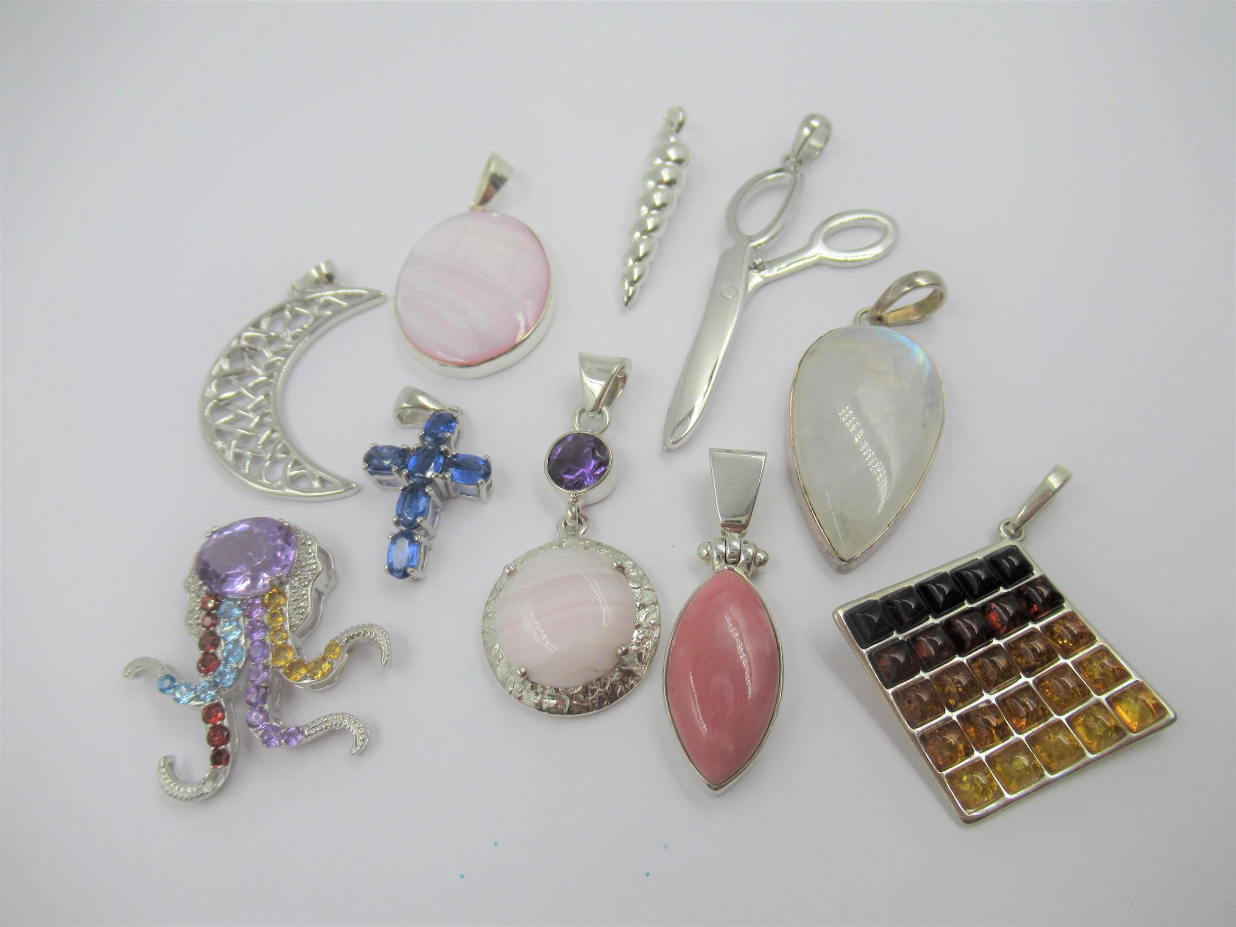 Group of ten various silver pendants set with various gem and semi precious stones