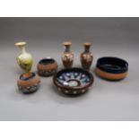 Two small Doulton stoneware bowls, similar miniature jardiniere, match striker, pair of Silicon ware