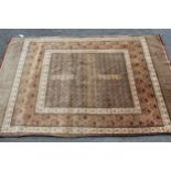 Cotton rug of Turkoman design in shades of beige and black, 6ft x 4ft approximately together with