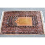 Indo Persian prayer rug with a Mihrab design in shades of iron red and beige, 4ft 10ins x 3ft