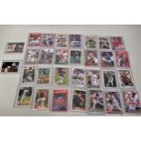 Collection of thirty American baseball collector's cards, in plastic sleeves, signed