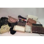 Two boxes containing a large quantity of ladies handbags and evening bags