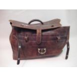 Leather holdall together with a collection of various ladies handbags and a pair of gentleman's