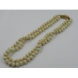 White coral uniform bead necklace with 18ct gold white coral set clasp, 17.5ins long approximately