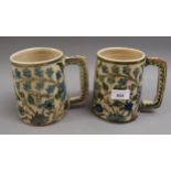 19th Century Iznik type mug of tapering form with painted floral decoration, 5.5ins high together