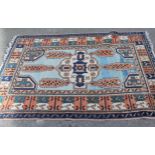 Kurdish rug, the central medallion with all over geometric design and multiple borders, on a blue