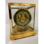 Jaeger-LeCoultre Atmos, gilt brass and glazed library clock, circular two-colour dial with Arabic