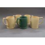Keith Murray for Wedgwood, group of four matt straw mugs (one handle at fault), together with a