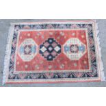 Small modern Caucasian design rug, 3ft 10ins x 2ft 10ins together with a similar smaller rug and two