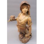 Late 19th Century French painted terracotta figure of a girl carrying a bag and posy of flowers,