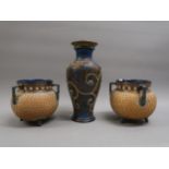 Pair of Royal Doulton stoneware cauldron form vases, each with three handles and all-over gilt