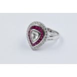 18ct White gold ring set with a pear shaped rose cut diamond surrounded by a band of rubies and a
