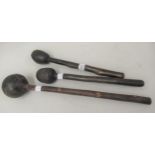 Group of three various throwing clubs