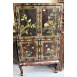 20th Century Chinese lacquer cabinet on stand with four rectangular panel doors decorated with birds