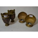 Pair of small brass and copper two handled baluster form pedestal vases decorated with classical