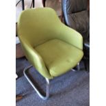 Mid 20th Century green textile tub shaped chair on shaped chromium supports