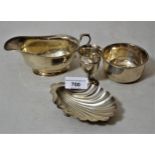 Silver sauce boat, shell form butter dish, small sugar basin and an egg cup, 6.5 troy ozs