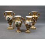 Pair of Paris Porcelain two handled baluster form vases with gilded finish and panels decorated with