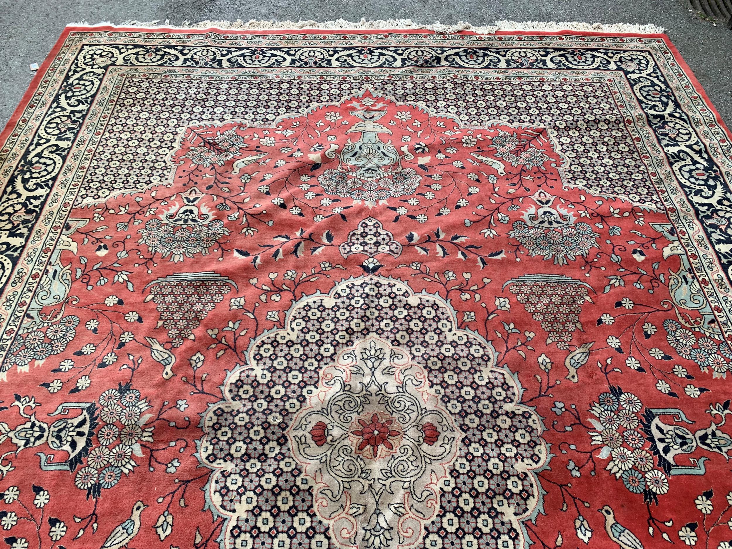 Large Indo Persian carpet with a medallion and vase design on a salmon ground with corner designs - Image 3 of 5