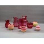 Five items of cranberry glass and four other small Victorian opaque glass vases